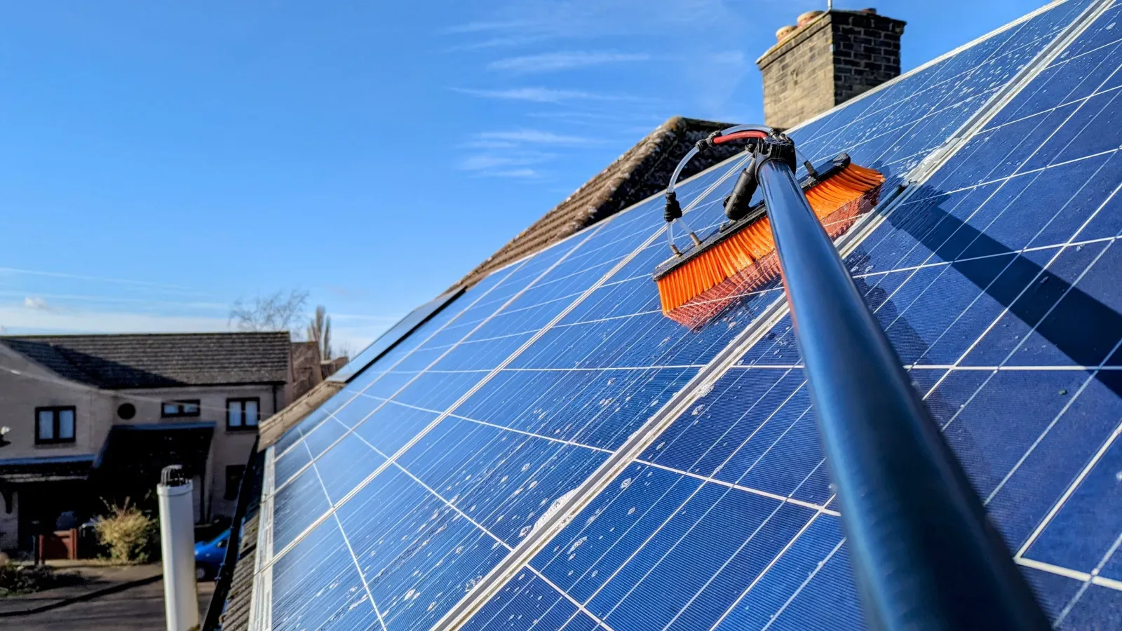 Soft-brush maintenance clean on a lightly soiled rooftop solar panel